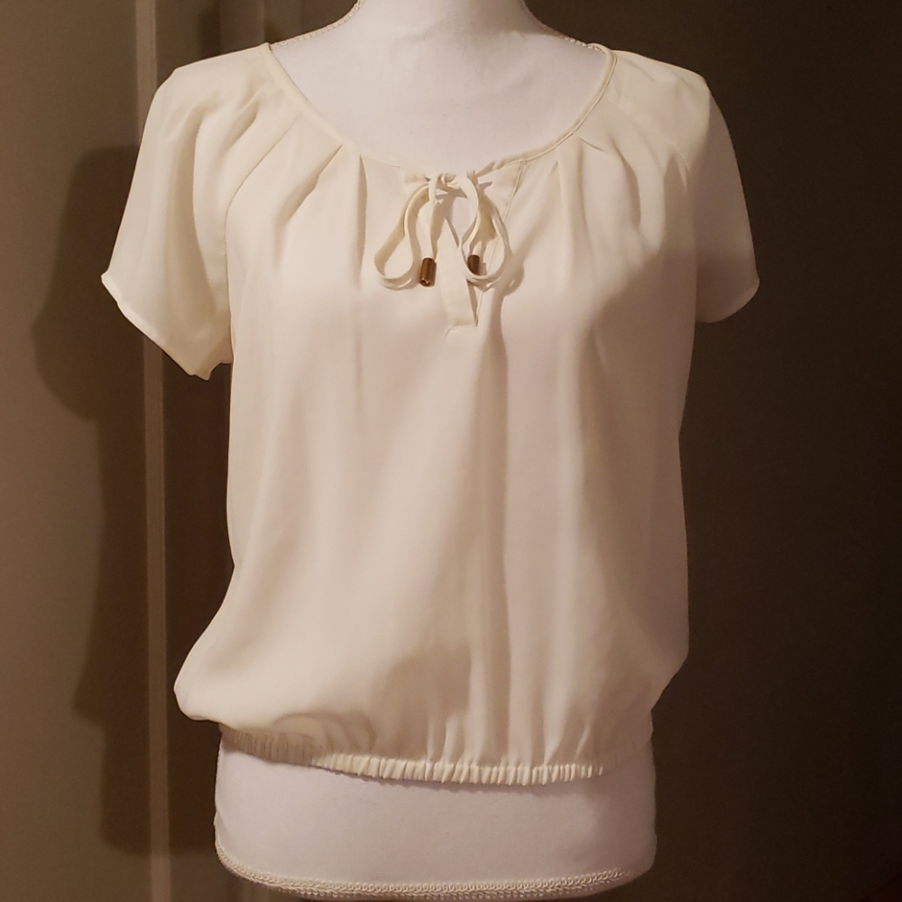 Semi-sheer cream blouse
